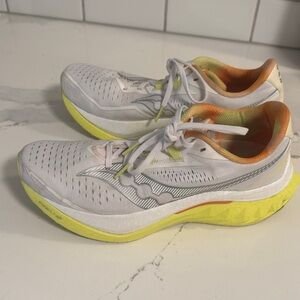 Saucony Women's White Running Shoes with Yellow and Orange Accents